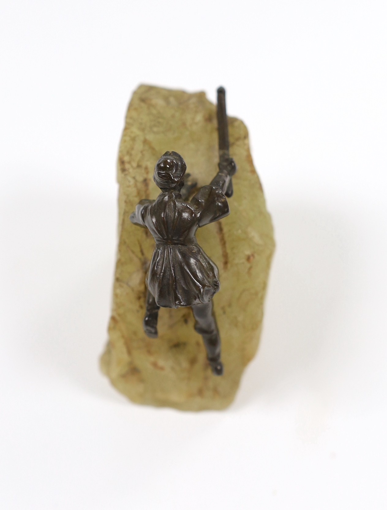 A small 20th century bronze of a climber on onyx, 8cm